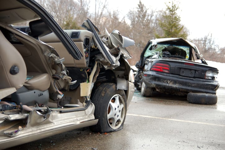 Carolina Collision and Frame Service | Two cars severely damaged in the road after a wreck