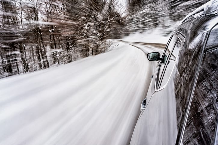 Carolina Collision and Frame Service | Car driving on a windy road in dangerous winter conditions